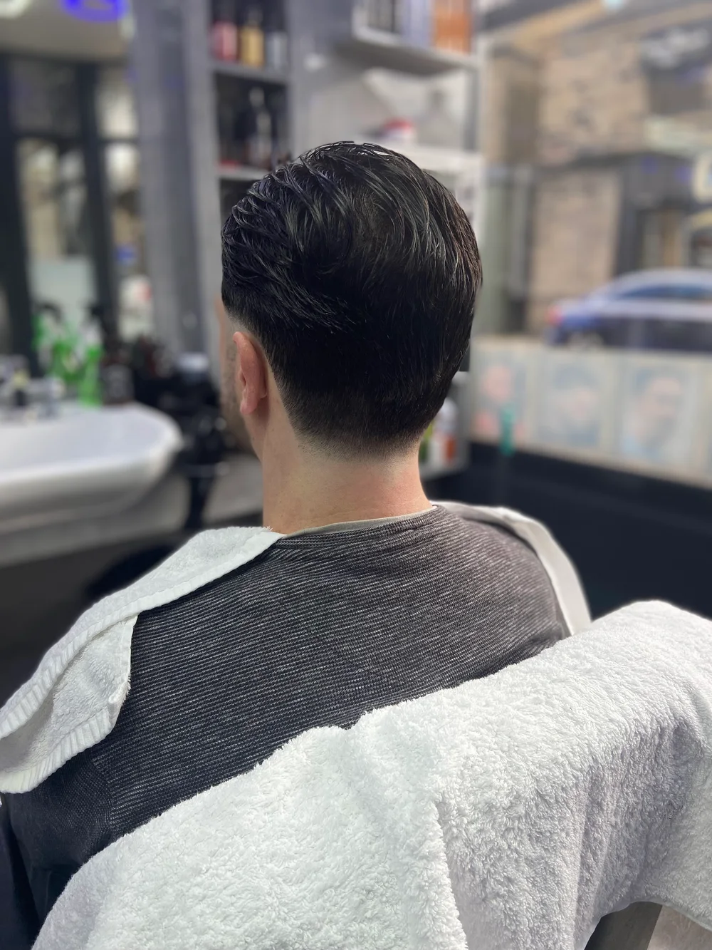 A close view of a tapered haircut at the back